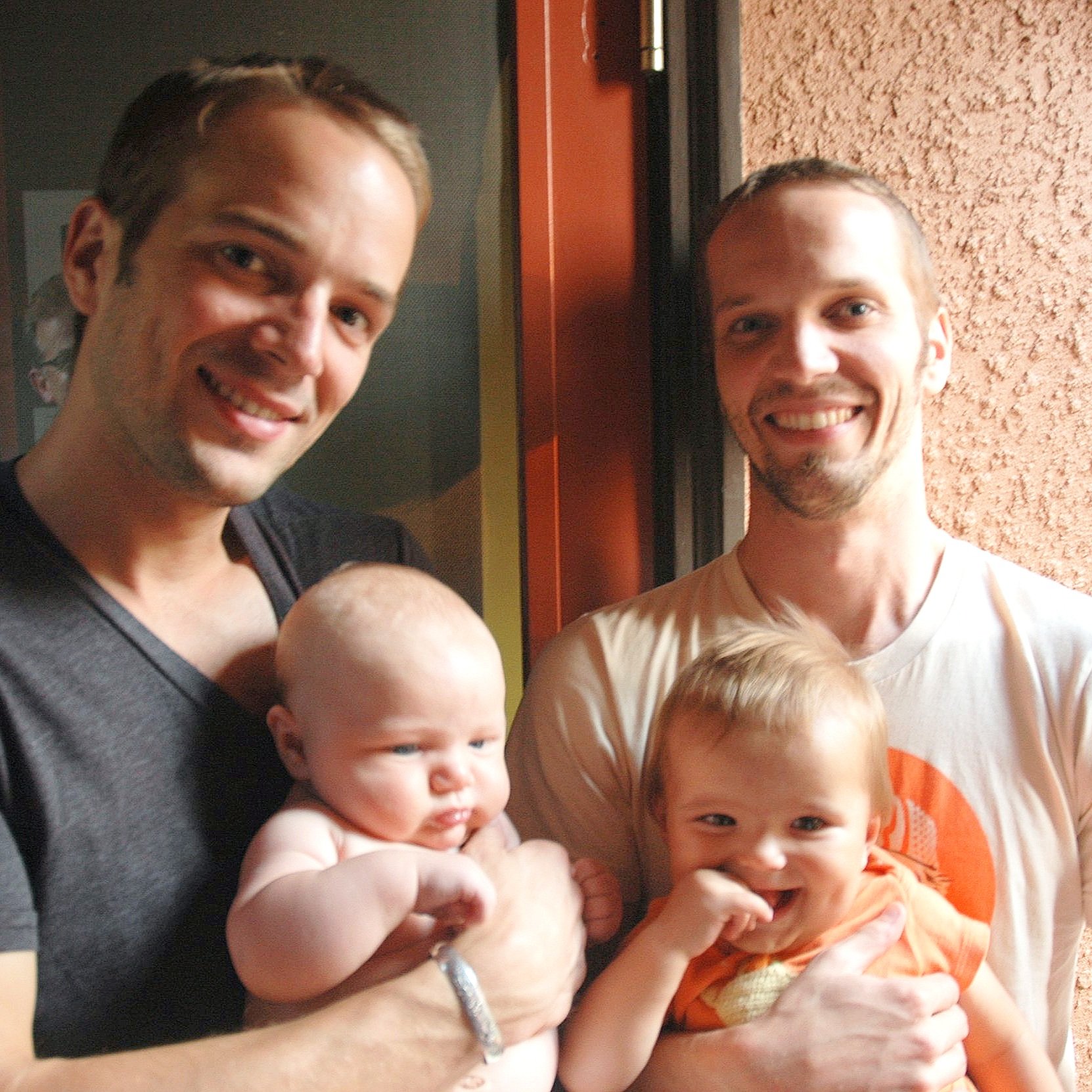 Photo of Tom and Stevie with babies